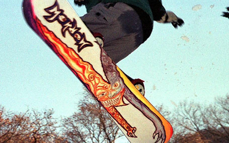 A snowboarder flies through the air at the Karuizawa Prince Ski Resort, about two hours from Tokyo.