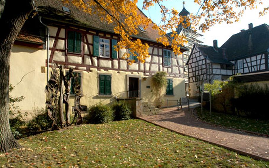 A view of Rockenhausen, Germany with the old farmhouse that houses the Turmuhrmuseum (Tower clock museum), the church and the Kahnweilerhaus, now a museum.