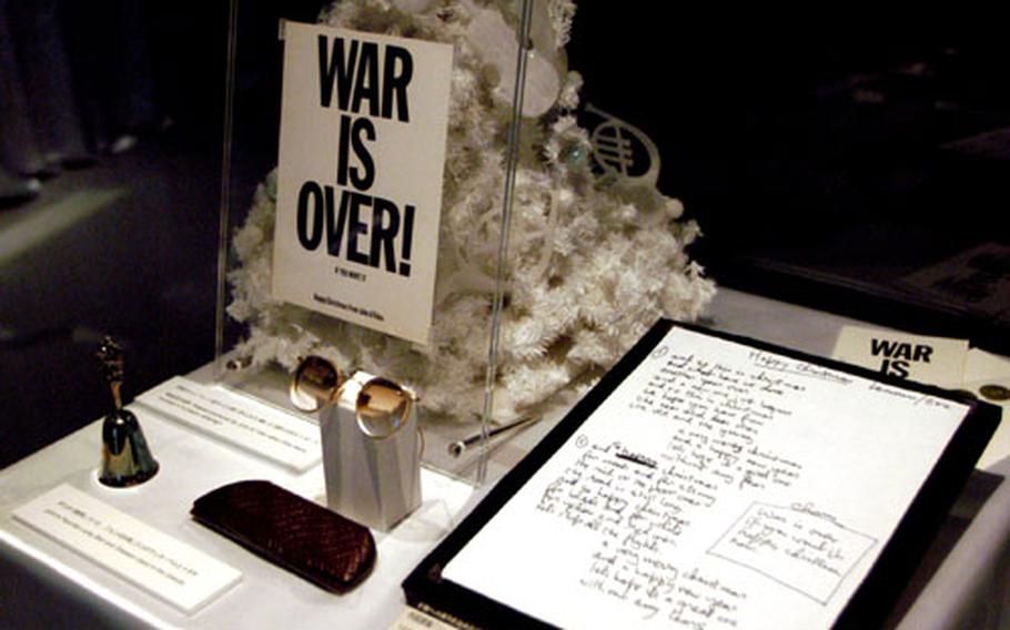 Lennon&#39;s lucky bell and the glasses he wore during the time "Happy Christmas" was written are displayed at a special exhibit.