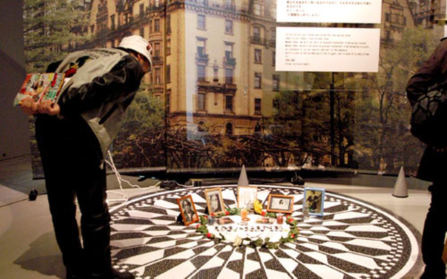 A man looks at the museum&#39;s replica of the “Strawberry Fields” monument at Central Park in New York.