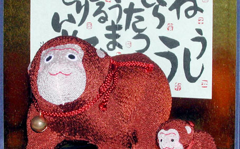 Monkey dolls are displayed in the window of Kyugetsu, a Japanese doll shop in Asakusabashi, Tokyo, for the Year of the Monkey.