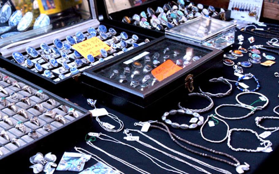 Vendors at Boro-ichi offer clothing, above, and accessories, below, such as silver necklaces, bracelets, broaches and rings with turquoise, lapis, old pieces of Japanese, Chinese and Vietnamese ceramics and more.
