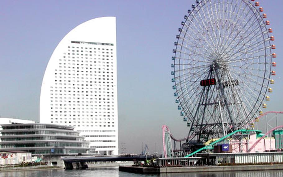 Yokohama&#39;s Grand Intercontinental Hotel and Cosmo Clock 21 ferris wheel. The unique shape of the 600-room hotel was modeled after a ship&#39;s sail.