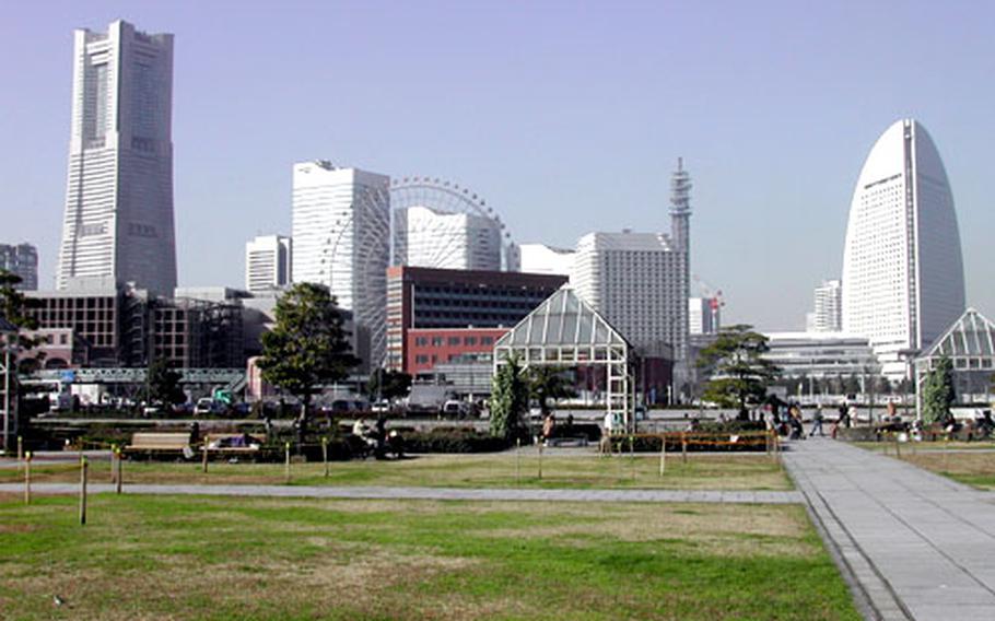 The skyline of Minato Mirai 21, from left: Yokohama Landmark Tower, Queen&#39;s Square Yokohama buildings, the ferris wheel and Yokohama Grand Intercontinental Hotel.