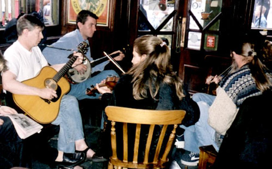 Musicians play at Oliver St. John Gogerty’s pub in Dublin.