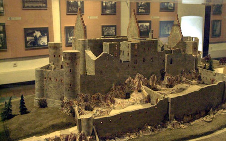 In one of the castle&#39;s three great rooms are a number of scale models of the castle at various periods in its history. This one shows the castle ruins around 1829. A local entrepreneur bought the castle, then sold its contents and even its roof, allowing the elements to destroy segments of the original structure.