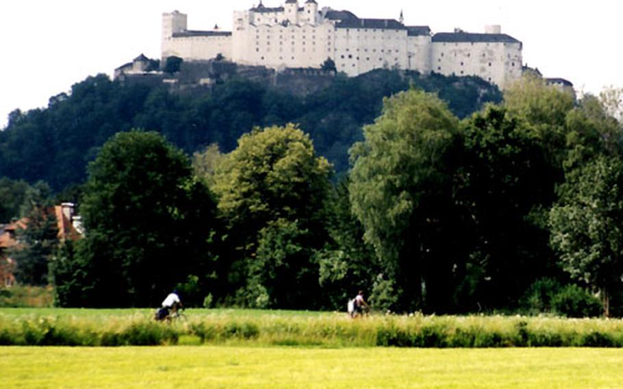 The route ends back in Salzburg with cycling beneath the Hohensalzburg fortress, which dominates the city.