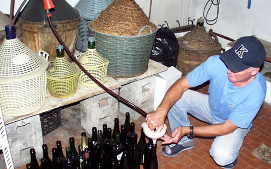 The vintner pours wine his vineyard produced last year into bottles that will soon adorn his dinner table.