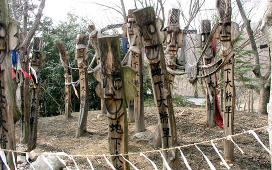 Carved wooden poles, or janseung, marked the boundaries of villages in old Korea and were believed to ward off bad luck and epidemics. These stand at Minsokchon.