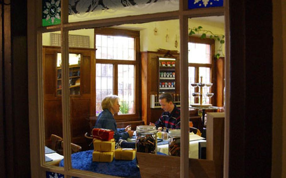 A couple enjoys chocolate cake at Eva Hess' Chocolaterie.