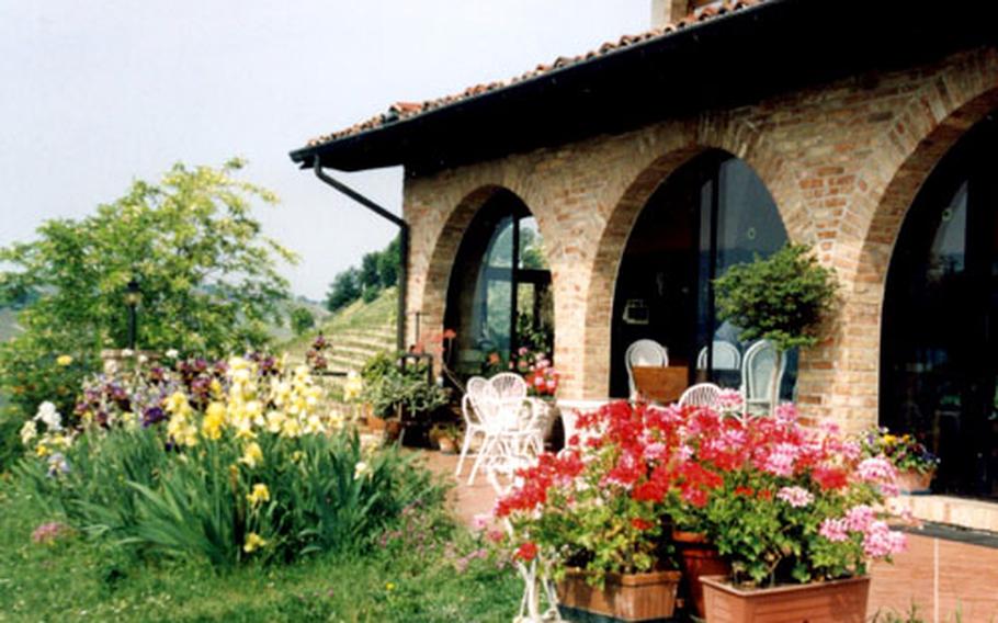 The agriturismo home, La Luna e i Falo, is decorated with beautiful furnishings inside and a bounty of blossoms outside.
