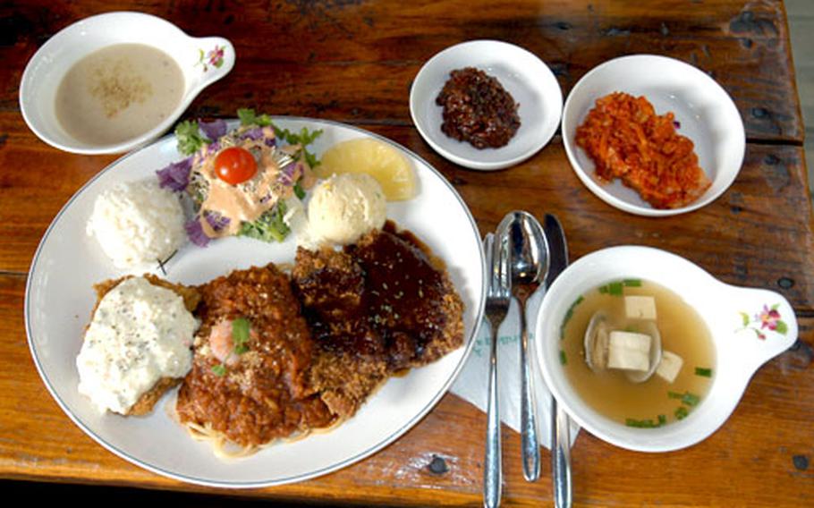 The Herb Island restaurant’s special meal, a mix of fish and pork cutlets, spaghetti, soup and various herb dishes.