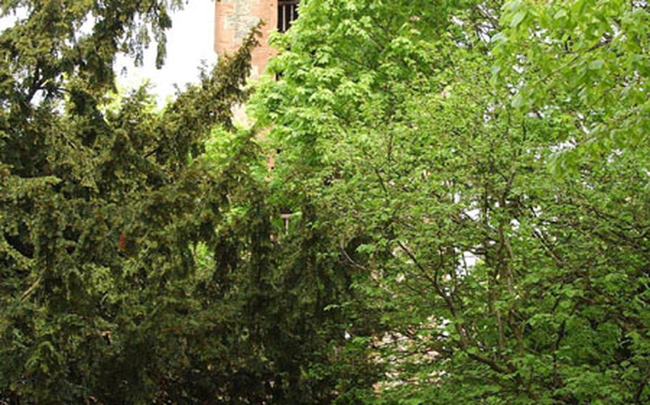 A couple walks from the inner courtyard of Burg Frankenstein toward its main gate. Recently discovered documents show that the castle may have existed as early as 948.