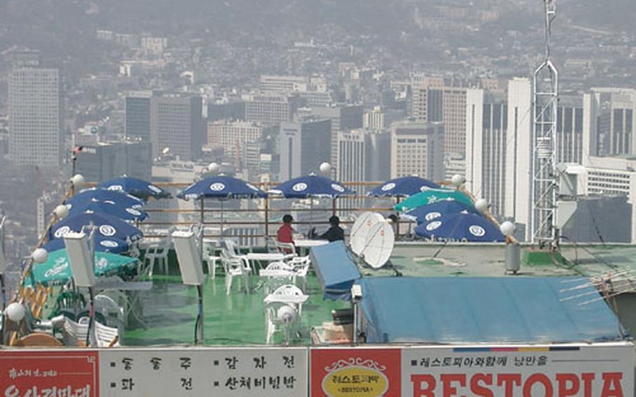 At the top of Namsan, just above the cable car house, you can stop and enjoy a snack and the view of downtown Seoul.