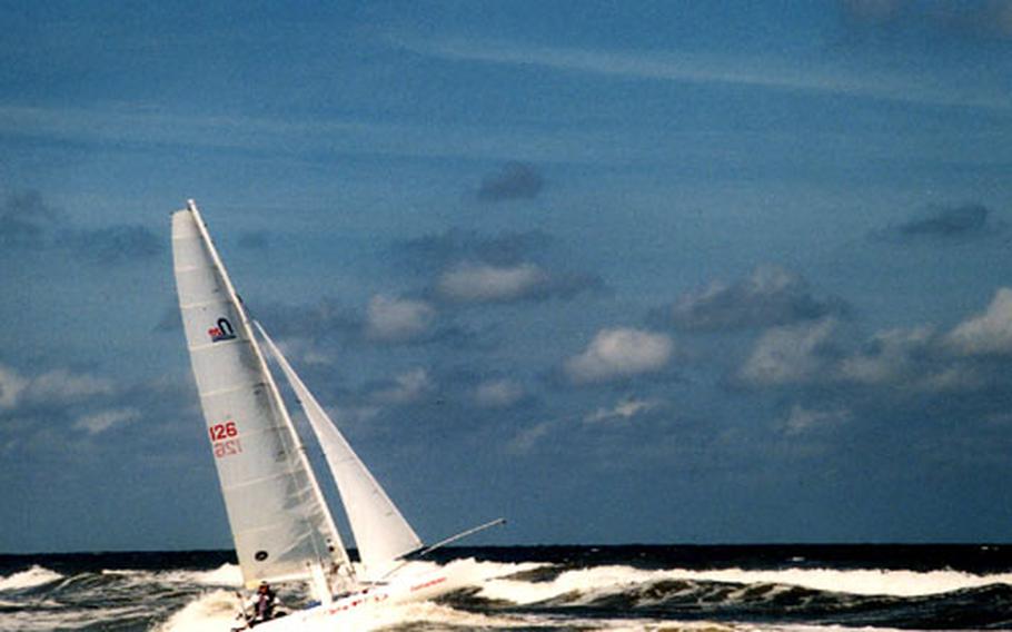 One of the two-man teams steers its catamaran through the surf during the Ronde om Texel race in 2003.