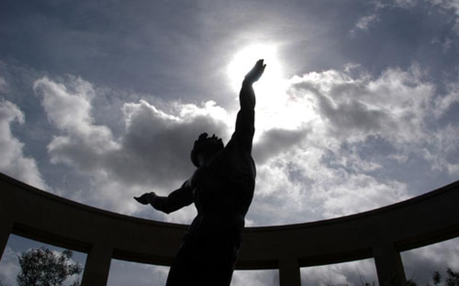 "The Spirit of American Youth Rising From the Waves" is an impressive bronze statue at the American cemetery at Omaha Beach.