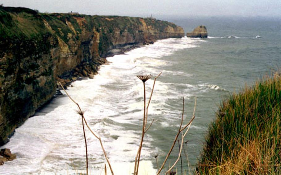 Heavy waves batter the cliffs of Pointe du Hoc, in Normandy, France. The cliffs were taken at low tide by U.S. Rangers on D-Day, 60 years ago.