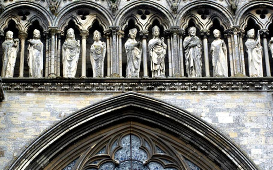 Detail above a stained-glass window of the 12th-century cathedral of Bayeux.