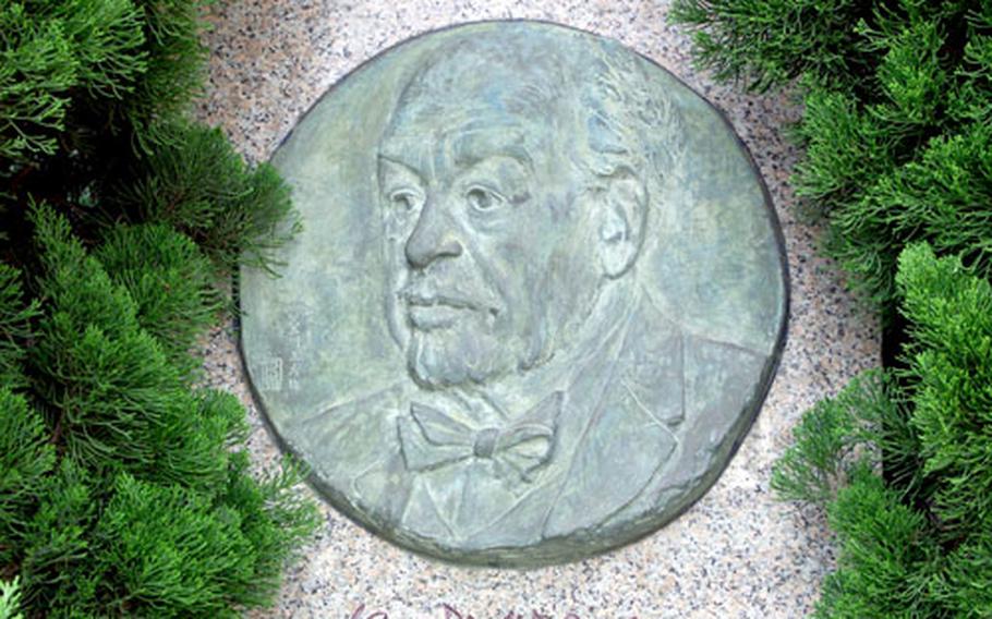 A monument honoring Dr. Langdon Warner at the west exit of Japan Rail&#39;s Kamakura Station.