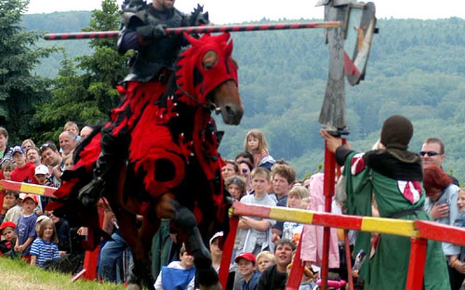 A knight spears the target with his lance in one of the competitions The target spins after being hit, and the knight that gets the most revolutions wins.