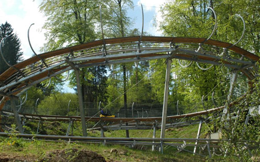 A toboggan reaches the final stretch of the 3,500-foot Sommerrodelbahn track. The toboggans operate with one lever used for both braking and accelerating.