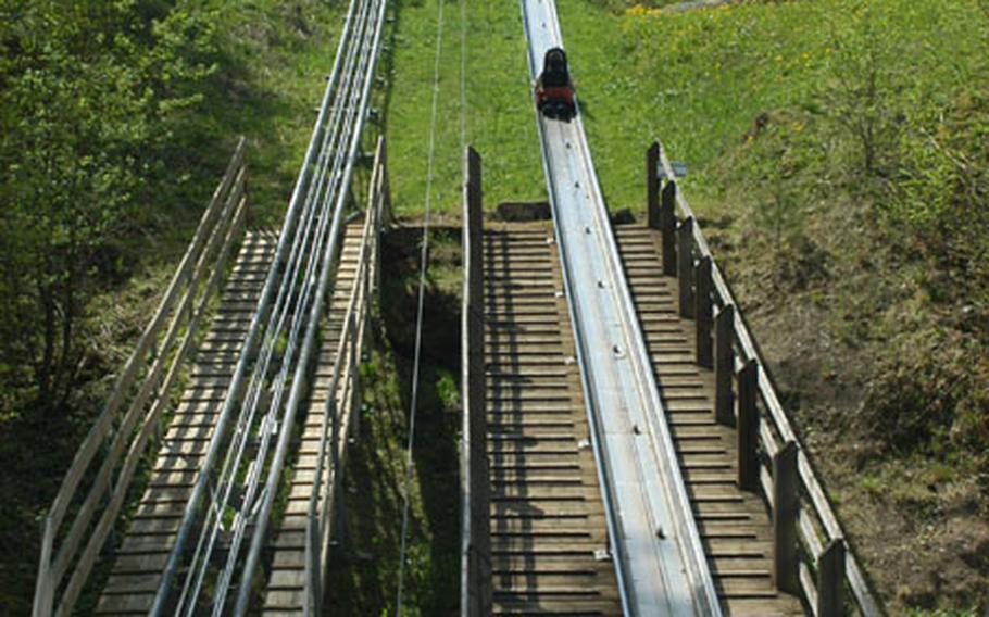A toboggan makes the slow trek to the top of the Sommerrodelbahn course. It takes between two to five minutes to reach the end of the approximately 3,500-foot (1,000 meter) course, located in Pottenstein, Germany.
