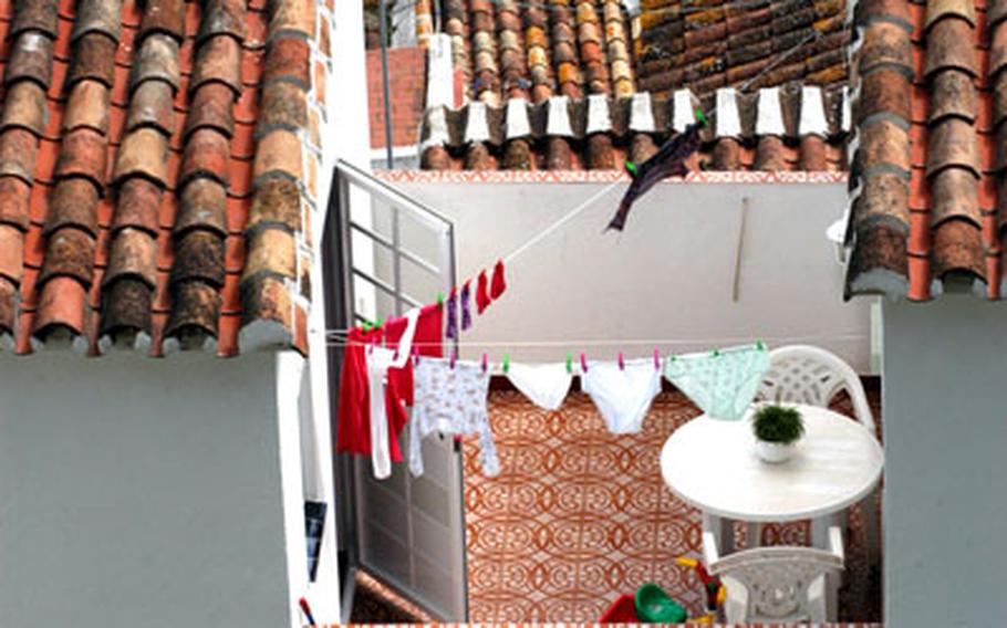 A little hidden terrace offers privacy amid the red roofs of a typical White Town.