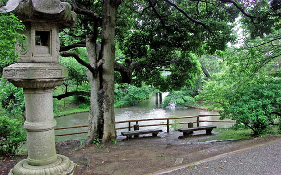 A garden lantern plays an important role in Japanese gardens. The intention of the design here is to form a harmony between architectural ornaments and natural features.