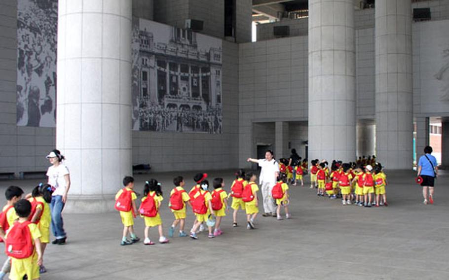 Groups of school children are a common sight at South Korea’s Independence Hall of Korea in Chonan. These children are making their way through the Grand Hall of the Nation, focal point of the vast, open-air complex devoted to the history of Korea’s efforts to oppose Japanese domination. Japan colonized Korea from 1910 to 1945.