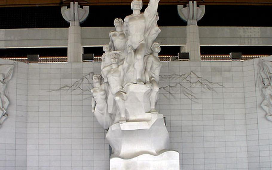 The granite Statue of Indomitable Koreans stands inside the Grand Hall of the Nation.