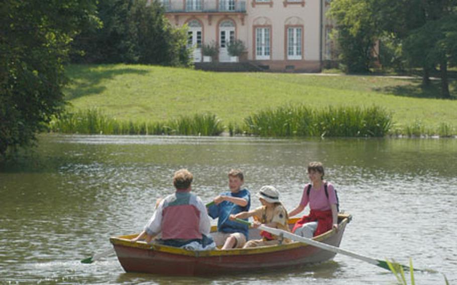 Rowing on the lake at Schönbusch Park, on the outskirts of Aschaffenburg, Germany. In the background is the small Schönbusch Palace, built by Emanuel Joseph von Herigoyen in the late 18th century.