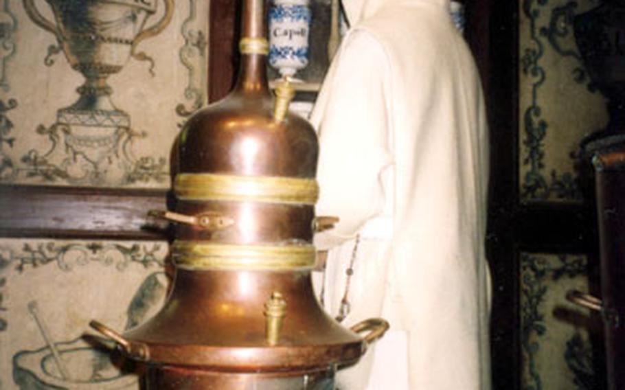 An exhibit on Chartreuse liqueur in the cellar of the monastery in Voiron, France, features a mannequin of a monk in an old-fashioned apothecary. The cellar is said to be the world’s largest liqueur cellar.