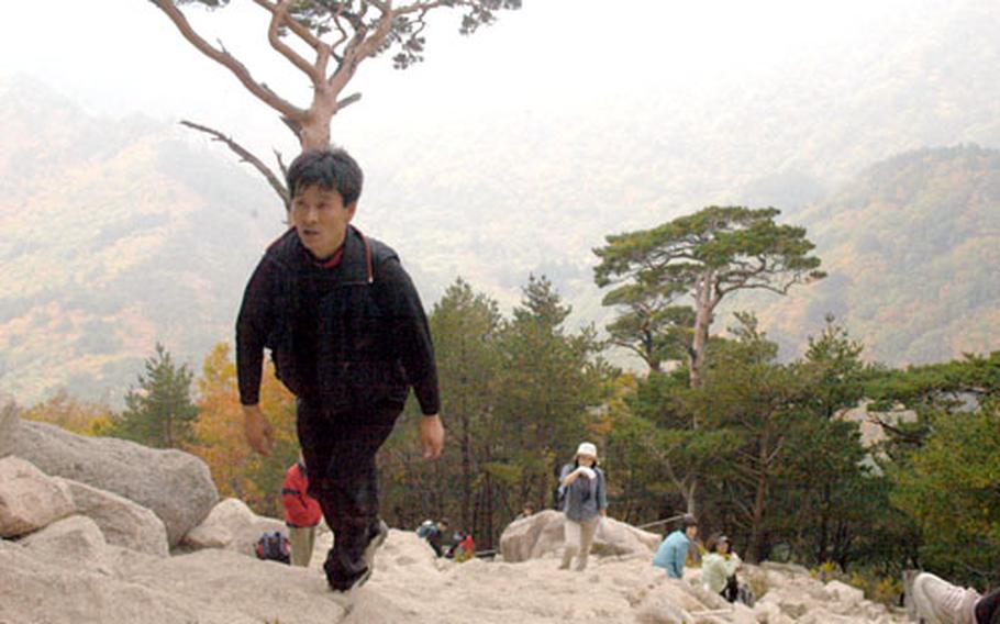 Hikers climb thousands of steps to the top of Ulsanbawi, one of the shorter climbs at Soraksan National Park in South Korea.