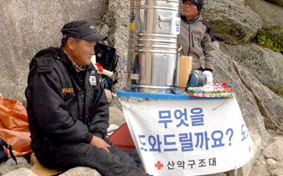 Vendors like this one at the summit of Ulsanbawi set up shop all over the park, eager to sell climbers a drink or souvenirs of their outing.