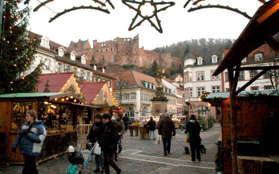 A view of the Heidelberg Christmas market, with the city&#39;s famed castle in the background.