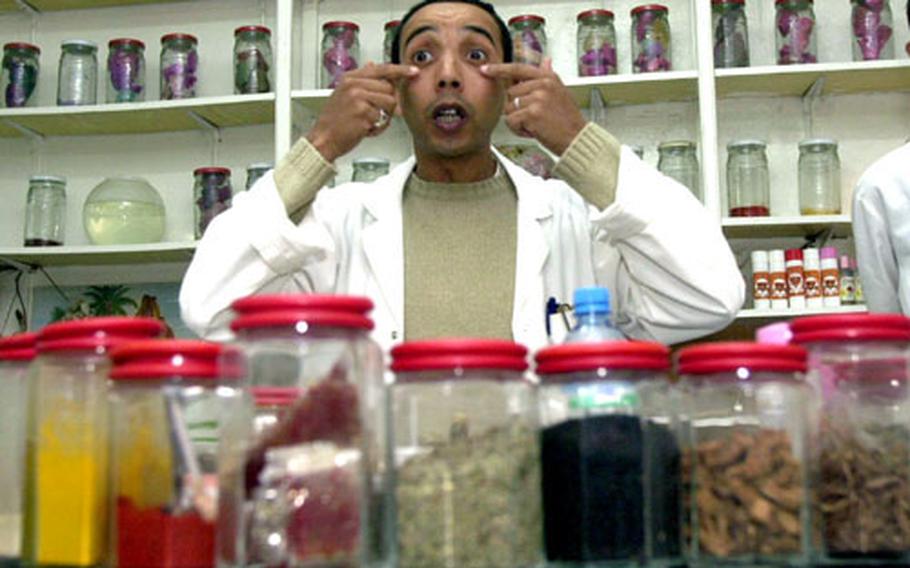 Sai'd Khayat talks about the different spices, oils and herbs sold at a spice shop in Tangier, Morocco.