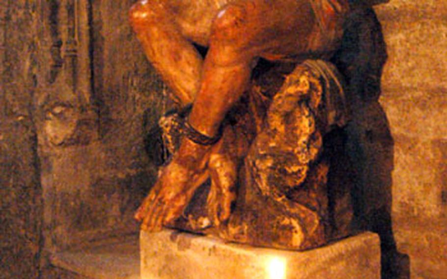 A statue of a bound Christ in the Notre-Dames-des-Doms cathedral in Avignon.