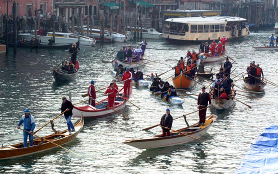 Witches and race participants mingle on the Grand Canal.