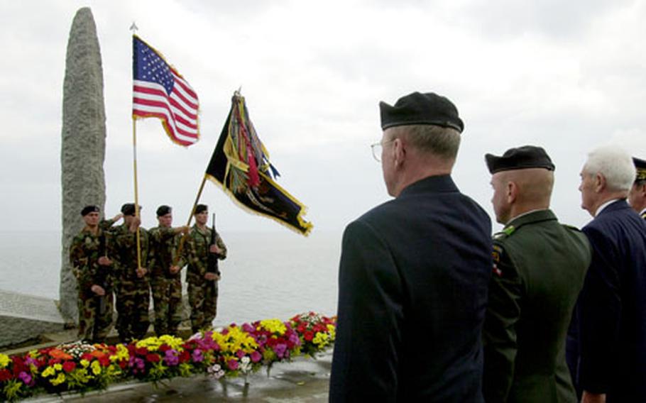 In conjunction with the 60th anniversary of the end of World War II, various locations in France will hold memorial ceremonies on May 8. Above, dignitaries salute the colors as taps plays at the D-Day ceremony at Pointe du Hoc in 2001.