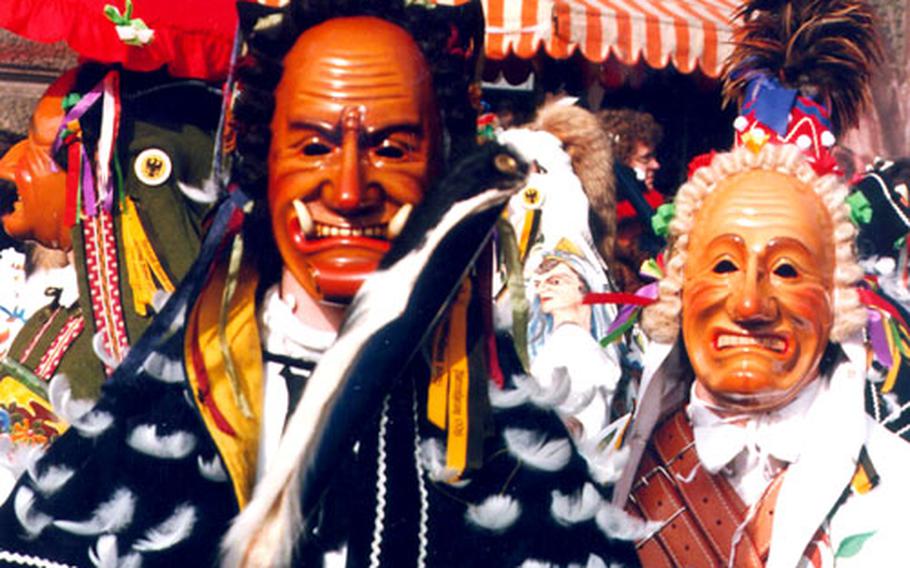 In the best-known Black Forest Fasnet celebration, the Narrensprung (Fools&#39; Jump), fools in colorful costumes and carved masks parade through Rottweil, Germany, on Rose Monday.