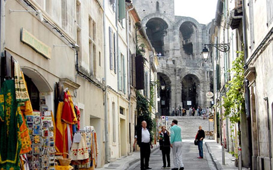 The Rue del&#39; Amphitheater in Arles leads to the city&#39;s famed Roman amphitheater, the Arenes, which dates to the end of the 1st Century.