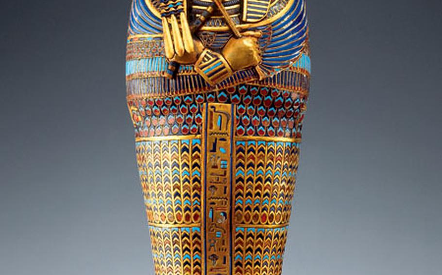 Made of gold, carnelian, rock crystal, obsidian and glass, this highly detailed miniature mummy coffinette with mask is one of four that held Tutankhamen’s embalmed organs. It had originally been made for Queen Neferneferuaten.