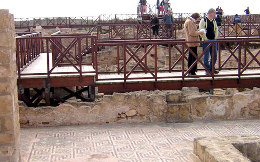 Wooden walkways take visitors over and around the extensive mosaics found in the ruins of the Roman Villa of Theseus.