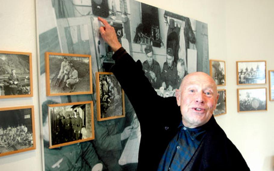 Hans Peter Kürten, who founded the museum in Remagen 25 years ago, stands before a display depicting everyday life for German troops. The main themes of the museum are war, peace and the history of the Ludendorff Bridge.