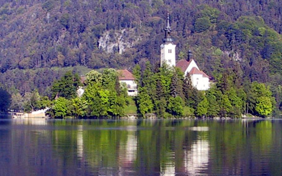 An uninhabited island sits peacefully in the center of Lake Bled.