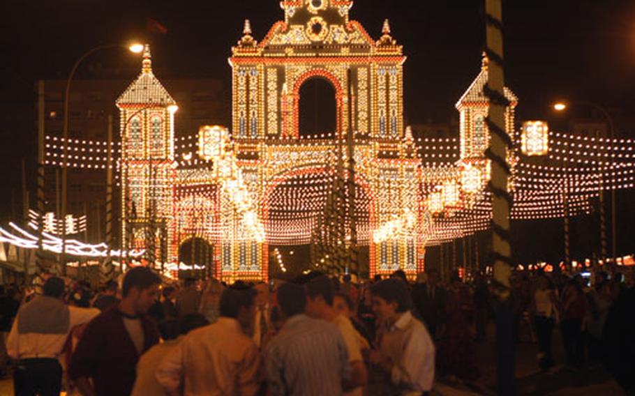 A huge gate marking the entrance to the Feria de Abril in 2004. This year&#39;s gate is to be in the shape of two large fans.