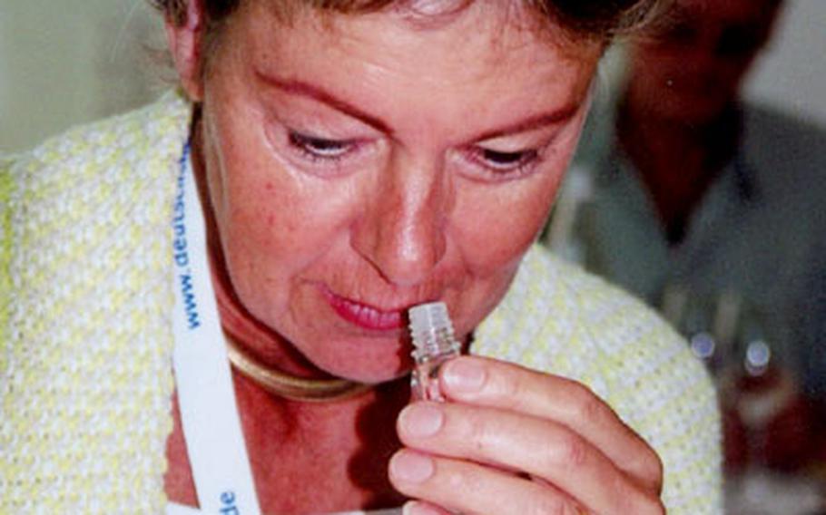One of the participants in the Women and Wine in Germany seminar tries to identify one of the common scents associated with wine.