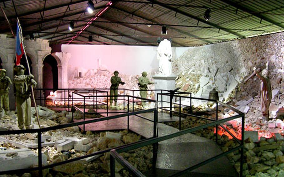 In one display at the Piana delle Orme museum, designed to look like the ruins of the abbey at Monte Cassino, life-sized mannequins dressed as German soldiers “surrender” to Allied troops. At least a dozen large displays depicting World War II scenes are featured at the museum.