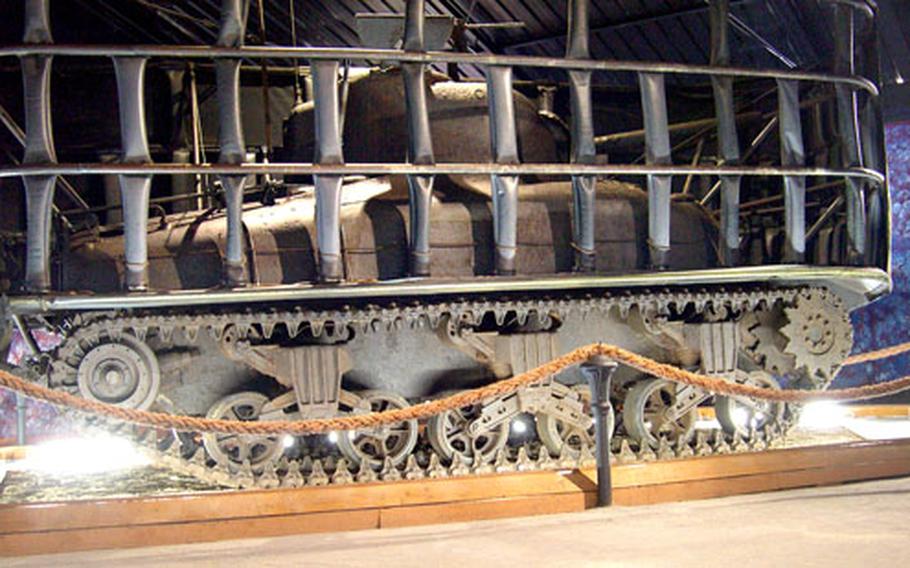 A rare amphibious Sherman tank from World War II is on display at the museum. The tank was lost off the Salerno coast and recovered in 1998. The tank actually floated and was moved by two propellers on its rear underside. The black skeleton surrounding the tank would be covered by a rubber shield and the tank would float ashore, drop the skeleton and shield, then drive off.