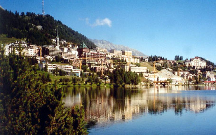 The town of St. Moritz, hugging the shores of a mountain lake, is popular in both summer and winter.